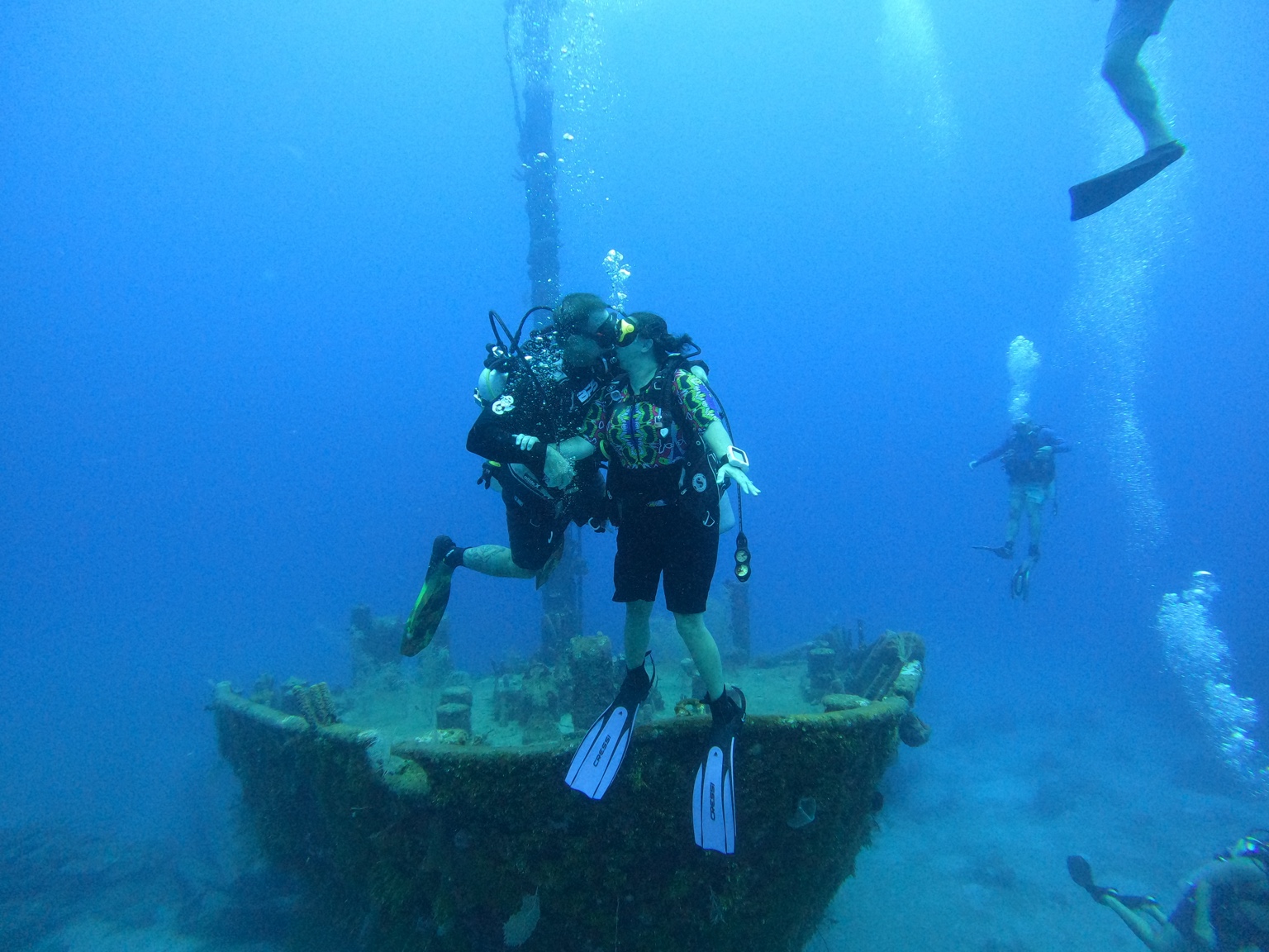 Scuba divers exploring an underwater wreck